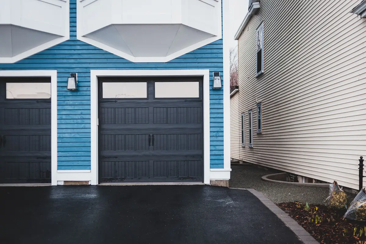 Front of a home with a wooden garage door