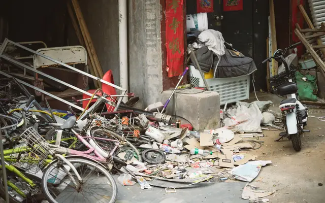 Old bikes, scrap metal and debris piled up for junk removal