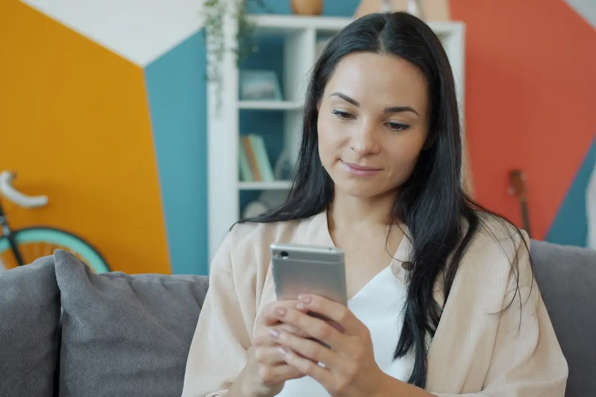 Homeowner searching on her phone at home